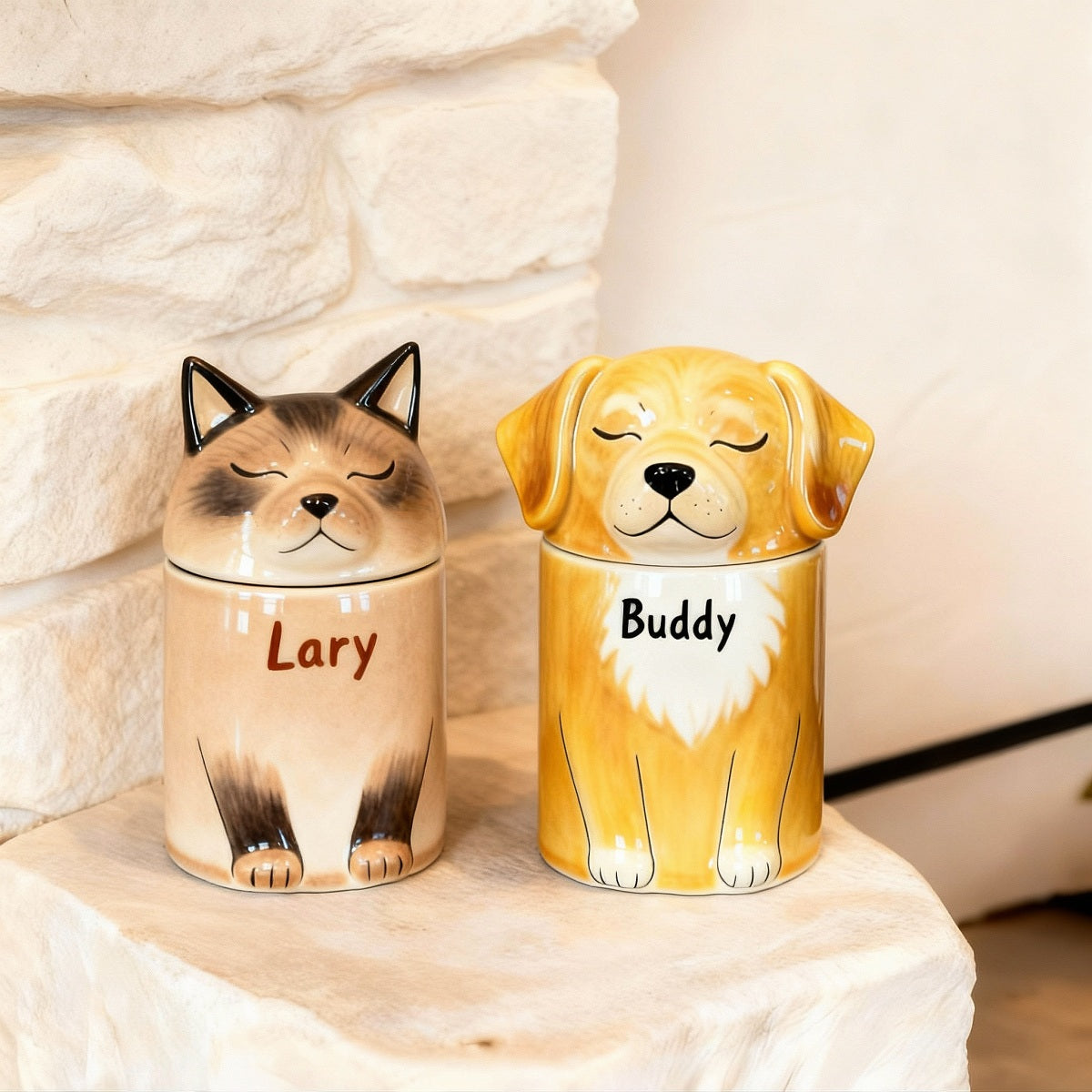 Two ceramic pet treat jars with dog designs